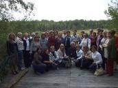 Учасники конференції на тлі озера…